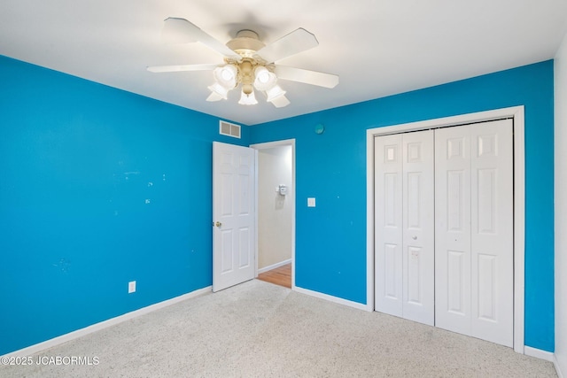 31500 Skyline Dr, California, MO 65018 - unfurnished bedroom with ceiling fan, a closet, and carpet flooring