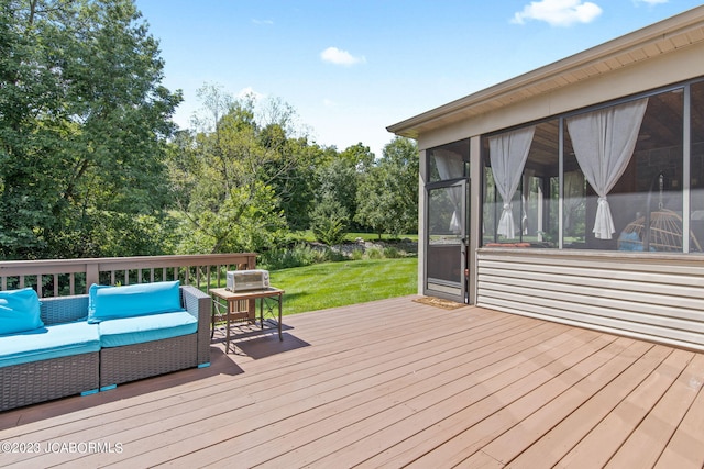 wooden deck featuring an outdoor hangout area, a lawn, and a sunroom