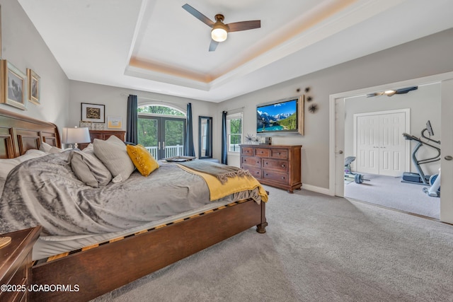1503 State Highway Z, Centertown, MO 65023 - bedroom with a tray ceiling, light carpet, a ceiling fan, french doors, and baseboards