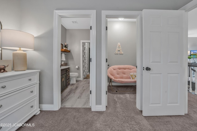 1503 State Highway Z, Centertown, MO 65023 - bedroom with light carpet, baseboards, and connected bathroom