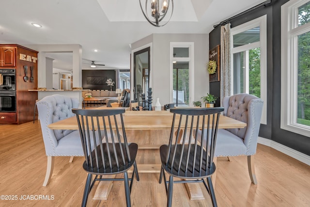 1503 State Highway Z, Centertown, MO 65023 - dining room with light wood-type flooring, a chandelier, and baseboards