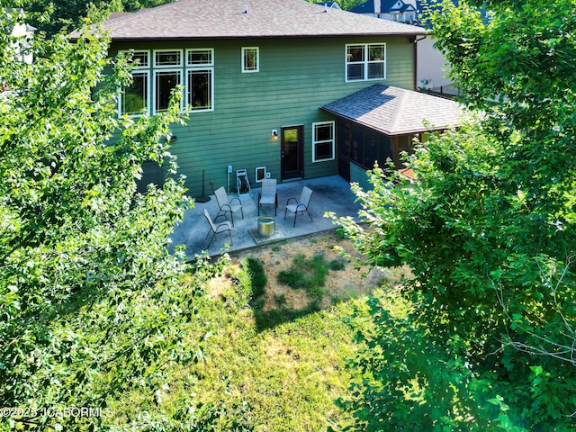 5004 Bates Creek Ct, Columbia, MO 65201 - back of house with a patio and a shingled roof