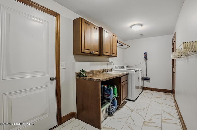 5004 Bates Creek Ct, Columbia, MO 65201 - washroom with separate washer and dryer, light marble finish flooring, and cabinet space