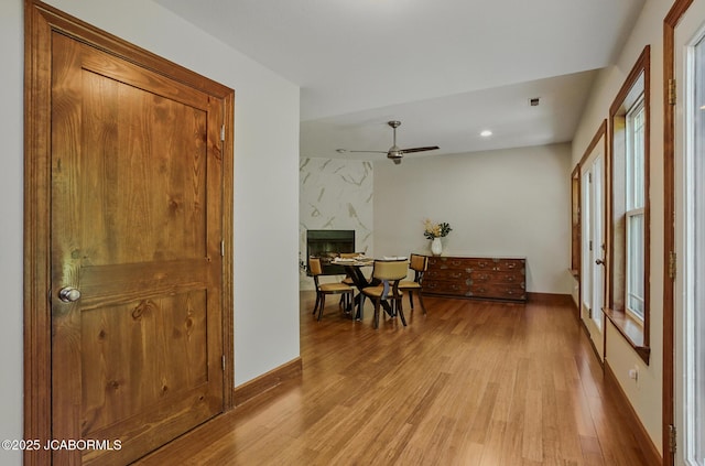 5004 Bates Creek Ct, Columbia, MO 65201 - dining room with plenty of natural light, light wood-style flooring, a ceiling fan, recessed lighting, and a premium fireplace
