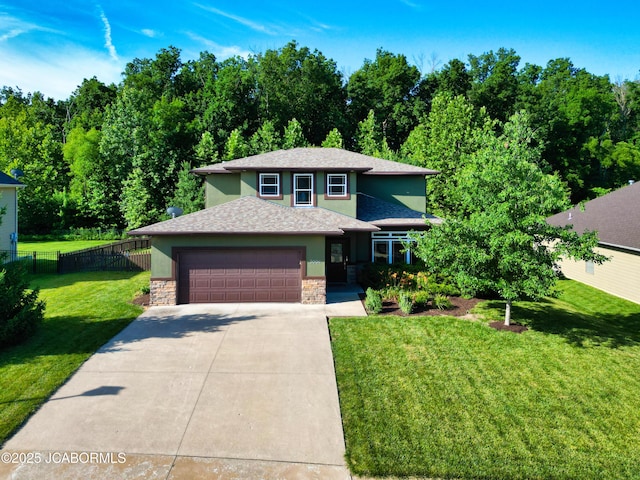 5004 Bates Creek Ct, Columbia, MO 65201 - view of front of home featuring stone siding, a garage, concrete driveway, and stucco siding