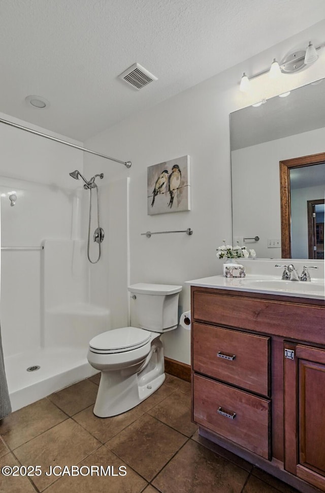 5004 Bates Creek Ct, Columbia, MO 65201 - full bath with vanity, a shower, tile patterned floors, and a textured ceiling