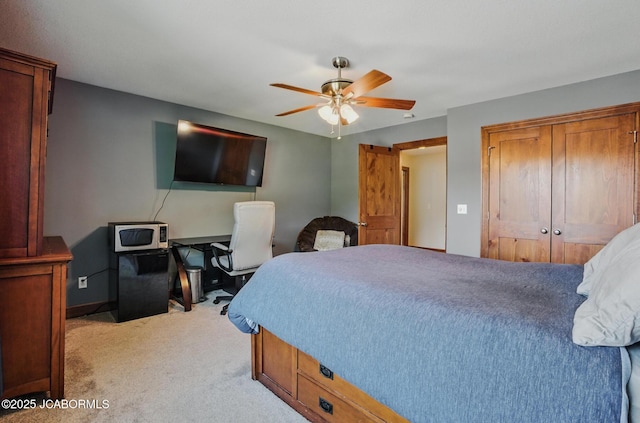 5004 Bates Creek Ct, Columbia, MO 65201 - bedroom featuring light carpet, a closet, and ceiling fan