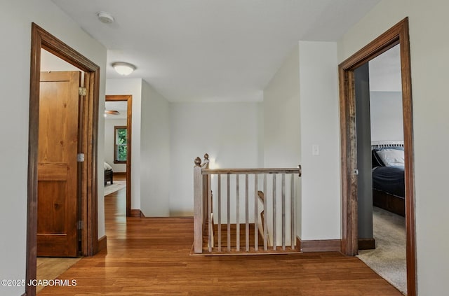 5004 Bates Creek Ct, Columbia, MO 65201 - hallway with an upstairs landing and wood finished floors