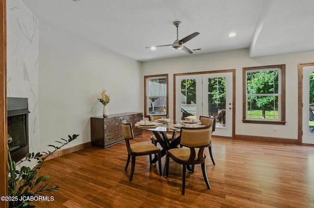 5004 Bates Creek Ct, Columbia, MO 65201 - dining area featuring light wood-style flooring, ceiling fan, recessed lighting, and a high end fireplace