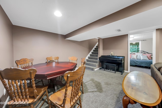 2213 Tanner Bridge Rd, Jefferson City, MO 65101 - dining area with carpet and stairs