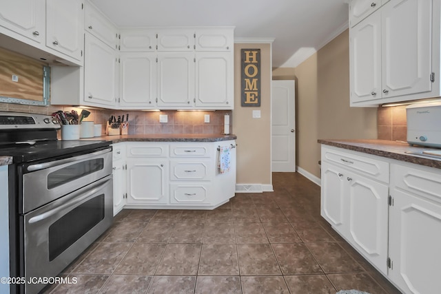 2213 Tanner Bridge Rd, Jefferson City, MO 65101 - kitchen featuring double oven range, dark countertops, white cabinetry, backsplash, and ornamental molding