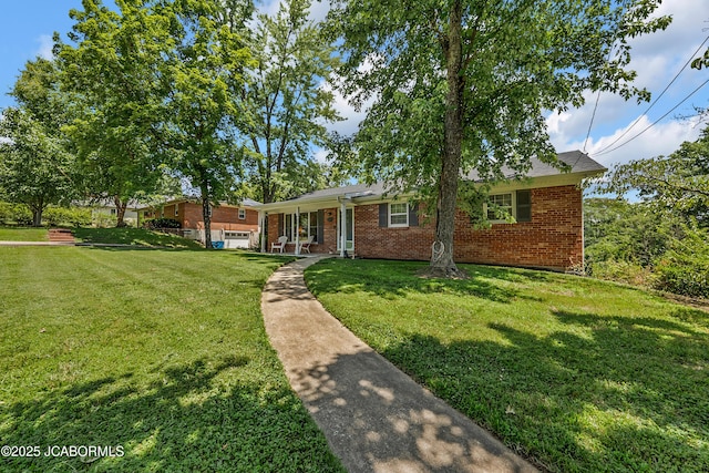 2213 Tanner Bridge Rd, Jefferson City, MO 65101 - view of front of property featuring a front lawn and brick siding