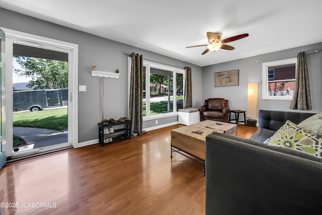 2213 Tanner Bridge Rd, Jefferson City, MO 65101 - living room with healthy amount of natural light, a ceiling fan, and wood finished floors
