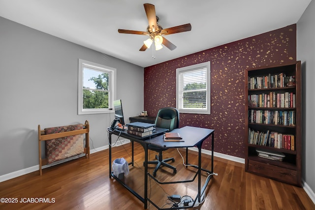 2213 Tanner Bridge Rd, Jefferson City, MO 65101 - office area with wallpapered walls, an accent wall, healthy amount of natural light, ceiling fan, and wood finished floors