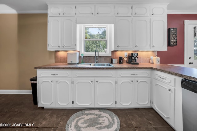 2213 Tanner Bridge Rd, Jefferson City, MO 65101 - kitchen featuring stainless steel dishwasher, dark countertops, crown molding, white cabinets, and decorative backsplash