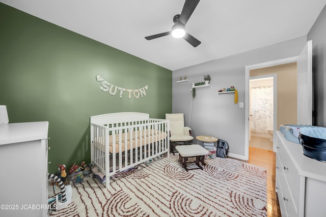 2213 Tanner Bridge Rd, Jefferson City, MO 65101 - bedroom with a ceiling fan, a nursery area, and light wood-style floors