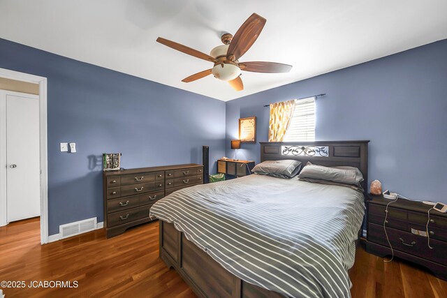 2213 Tanner Bridge Rd, Jefferson City, MO 65101 - bedroom with dark wood finished floors and a ceiling fan