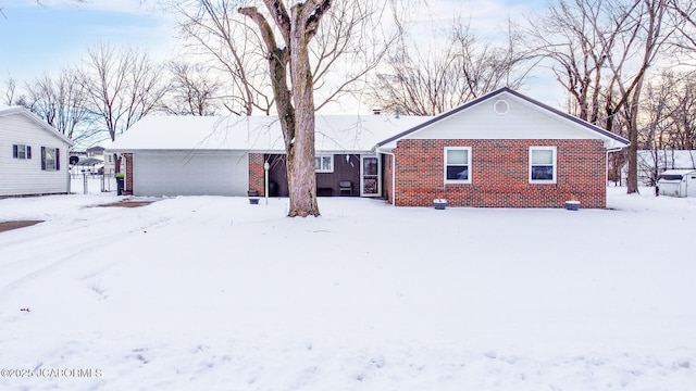 single story home featuring a garage