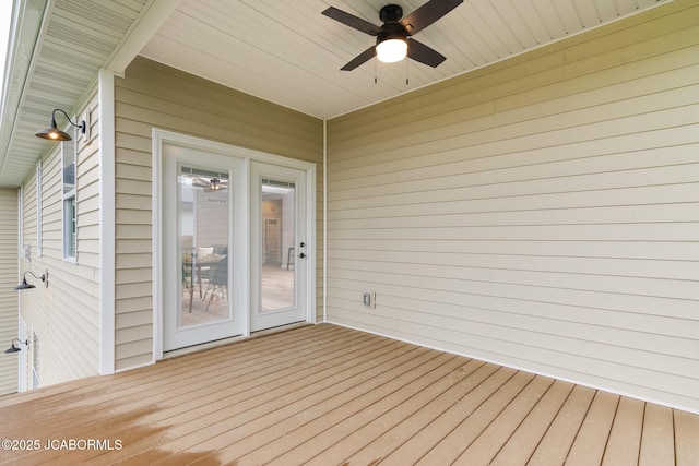 wooden terrace featuring ceiling fan