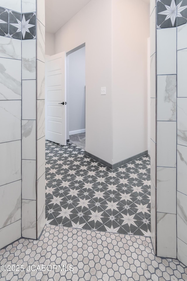 bathroom featuring tile patterned floors and baseboards