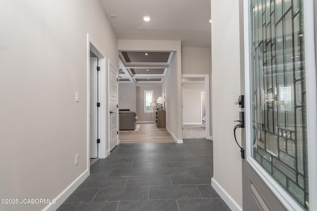 hall featuring baseboards, recessed lighting, coffered ceiling, and beam ceiling