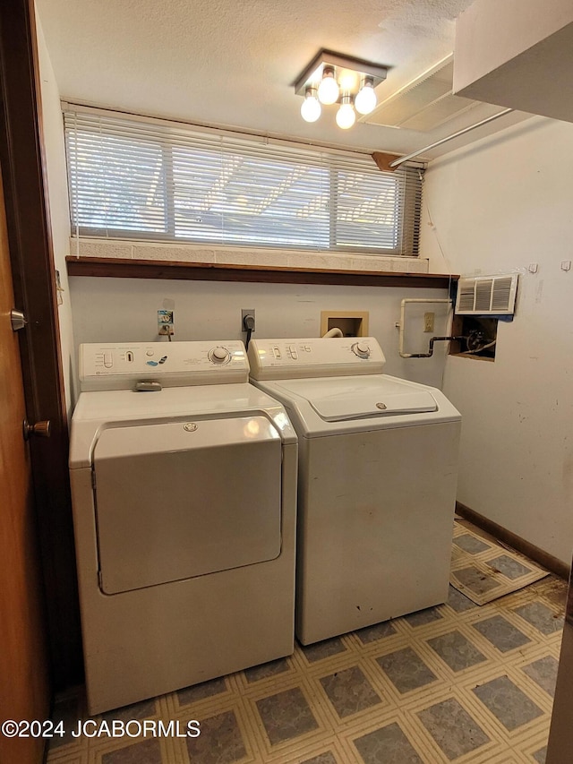 laundry room with washing machine and clothes dryer