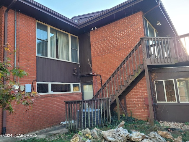 view of side of home featuring central AC unit