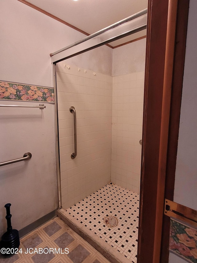 bathroom with tiled shower