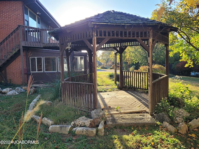 wooden terrace featuring a gazebo