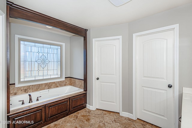 6002 Sterling Ridge Rd, Jefferson City, MO 65101 - bathroom featuring a bath and baseboards