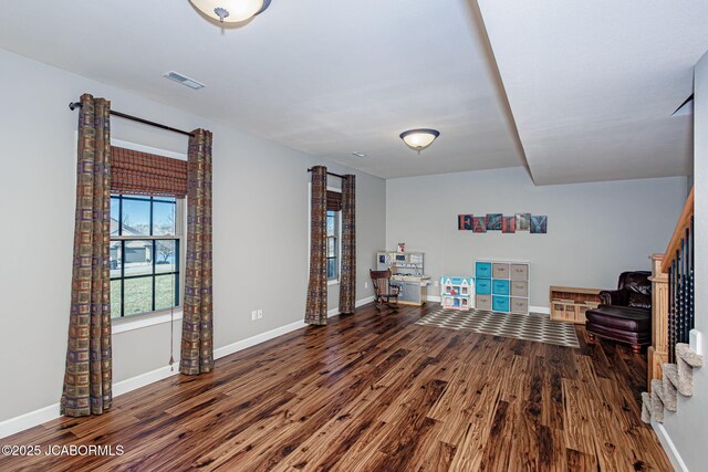 6002 Sterling Ridge Rd, Jefferson City, MO 65101 - living area with wood finished floors, baseboards, and stairs