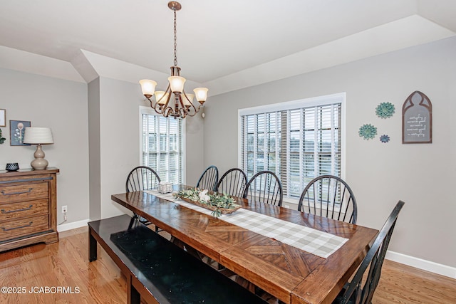 6002 Sterling Ridge Rd, Jefferson City, MO 65101 - dining room with light wood-style flooring, plenty of natural light, a chandelier, and baseboards