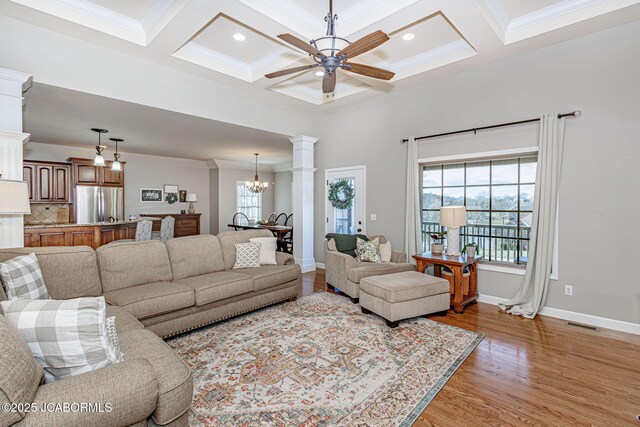 6002 Sterling Ridge Rd, Jefferson City, MO 65101 - living area featuring ceiling fan, coffered ceiling, light wood-style flooring, baseboards, and a chandelier
