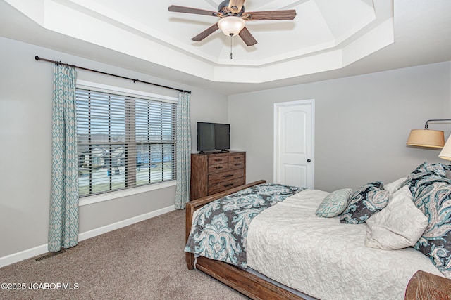6002 Sterling Ridge Rd, Jefferson City, MO 65101 - carpeted bedroom featuring a raised ceiling, baseboards, and a ceiling fan