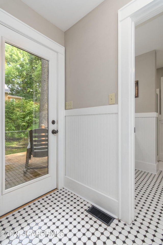 1311 Elmerine Ave, Jefferson City, MO 65101 - doorway featuring wainscoting and tile patterned flooring