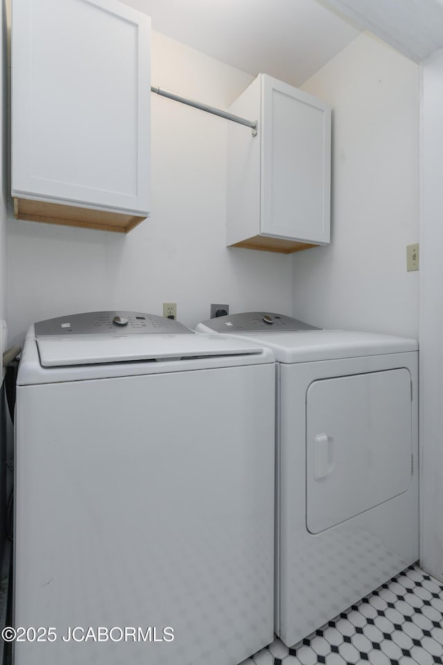 1311 Elmerine Ave, Jefferson City, MO 65101 - laundry room featuring cabinet space and washer and dryer
