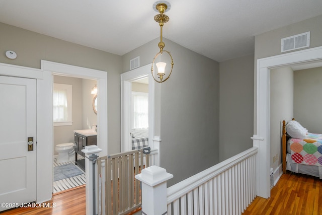 1311 Elmerine Ave, Jefferson City, MO 65101 - corridor with wood finished floors and an upstairs landing
