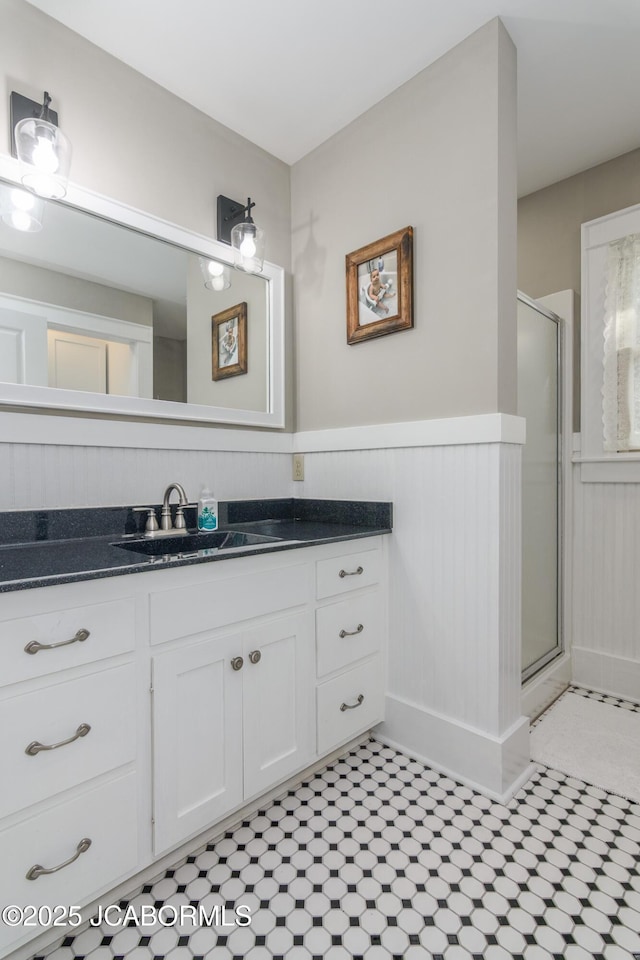 1311 Elmerine Ave, Jefferson City, MO 65101 - full bath with vanity, a shower stall, and wainscoting