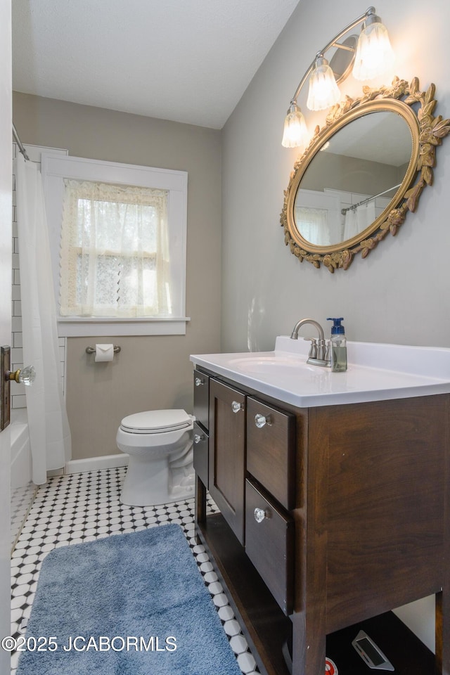 1311 Elmerine Ave, Jefferson City, MO 65101 - bathroom with vanity, shower / bath combo, and tile patterned floors