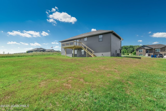 5705 Summerfield Ct, Jefferson City, MO 65109 - rear view of house featuring stairs, a deck, and a yard