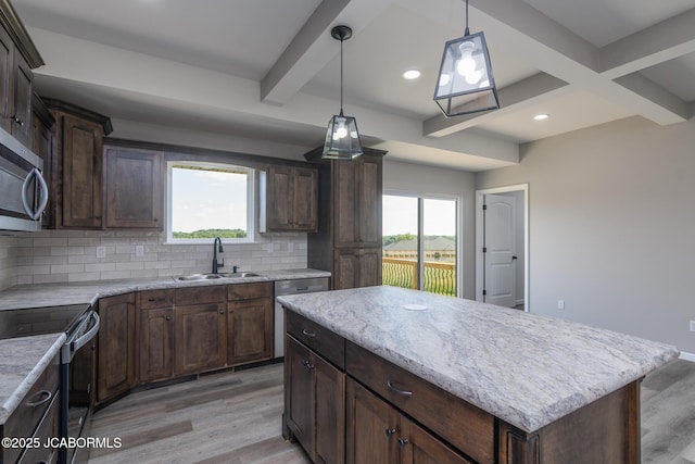 5705 Summerfield Ct, Jefferson City, MO 65109 - kitchen with appliances with stainless steel finishes, beamed ceiling, backsplash, light wood-style flooring, and pendant lighting