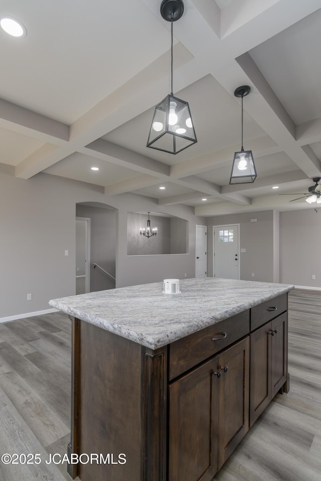 5705 Summerfield Ct, Jefferson City, MO 65109 - kitchen with coffered ceiling, light wood finished floors, open floor plan, decorative light fixtures, and beam ceiling