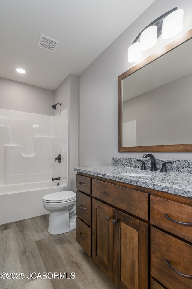 5705 Summerfield Ct, Jefferson City, MO 65109 - full bath with wood finished floors, vanity, and shower / washtub combination