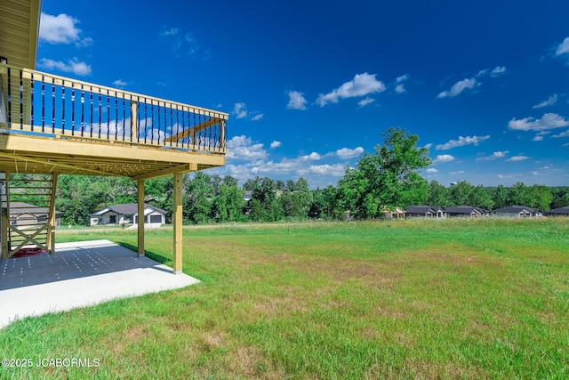 5705 Summerfield Ct, Jefferson City, MO 65109 - view of green lawn featuring a patio area and a deck