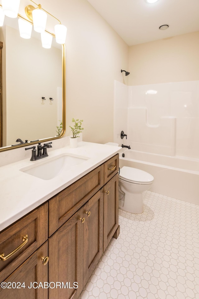 full bathroom featuring tile patterned flooring, vanity, toilet, and washtub / shower combination