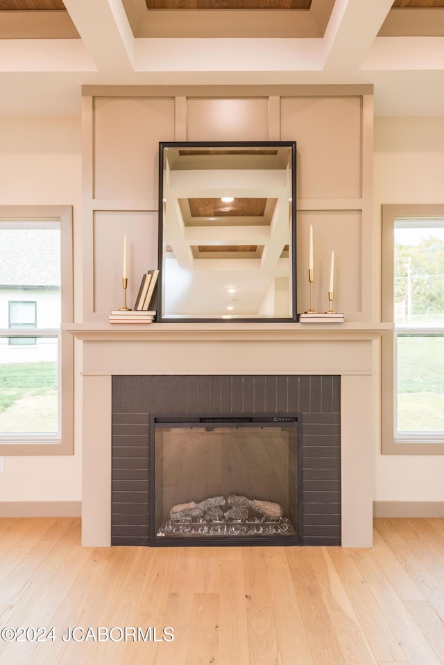 interior details with hardwood / wood-style flooring and a brick fireplace