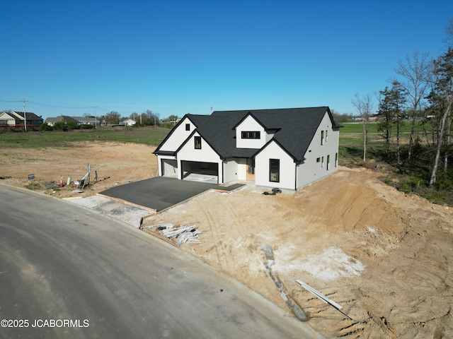 6343 Yellowstone Dr, Ashland, MO 65010 - view of front of property featuring aphalt driveway and a garage