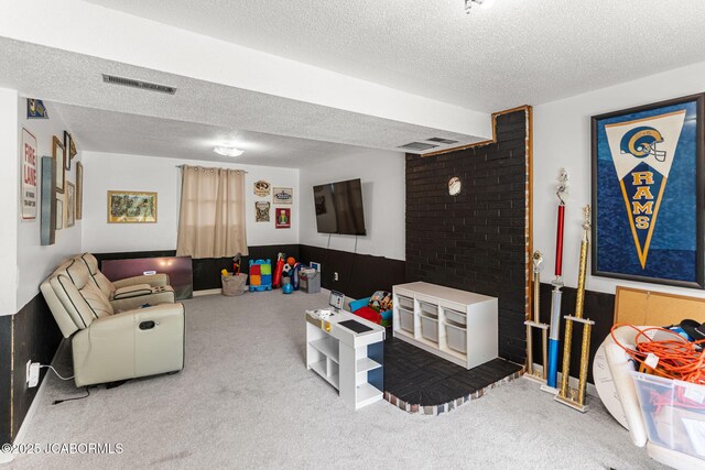 5501 S Brooks Dr, Jefferson City, MO 65109 - living area featuring a textured ceiling and carpet flooring