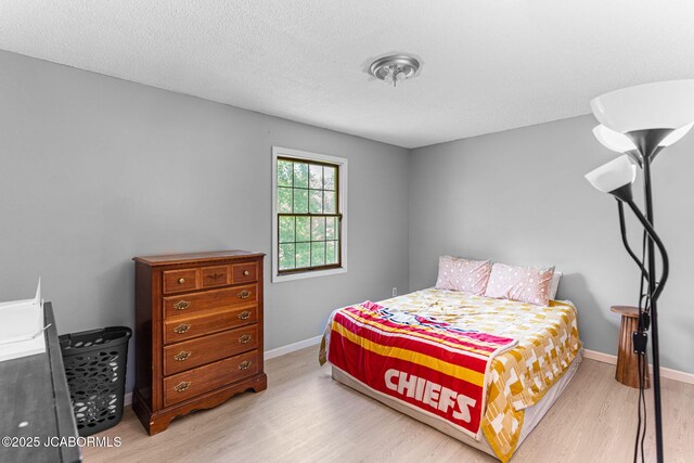 5501 S Brooks Dr, Jefferson City, MO 65109 - bedroom featuring light wood finished floors and baseboards