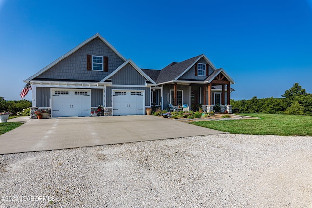 craftsman house with a porch, board and batten siding, concrete driveway, and a front lawn